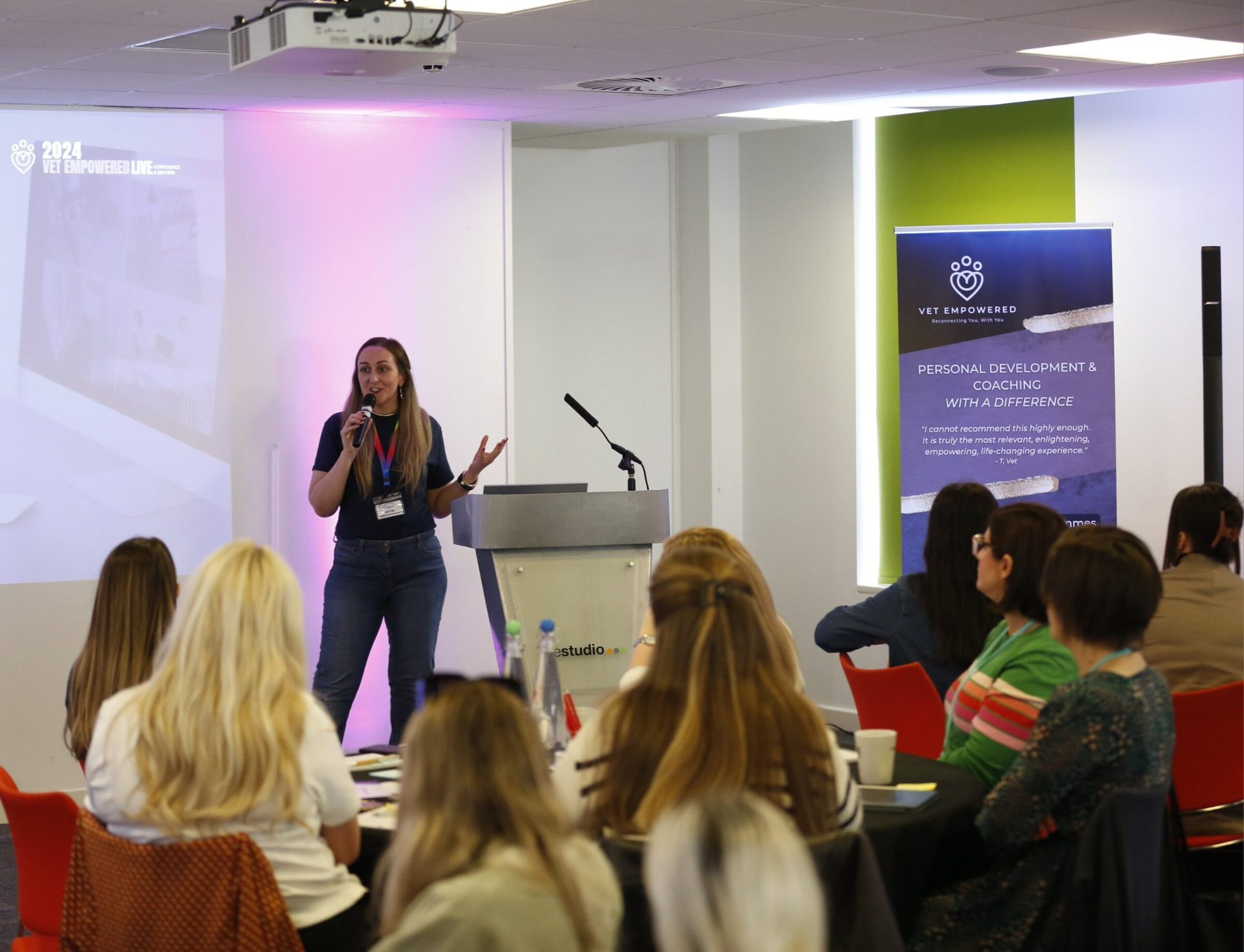 A Vet Empowered coach speaking to a full room of veterinary professionals