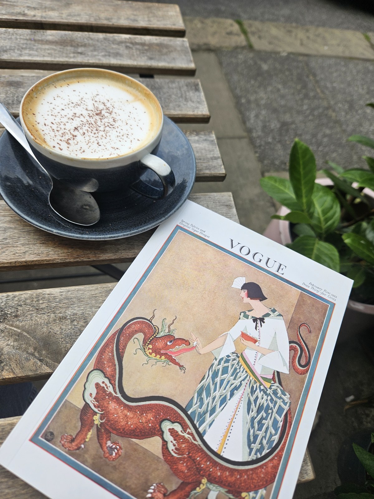 A coffee beside an illustrated notebook