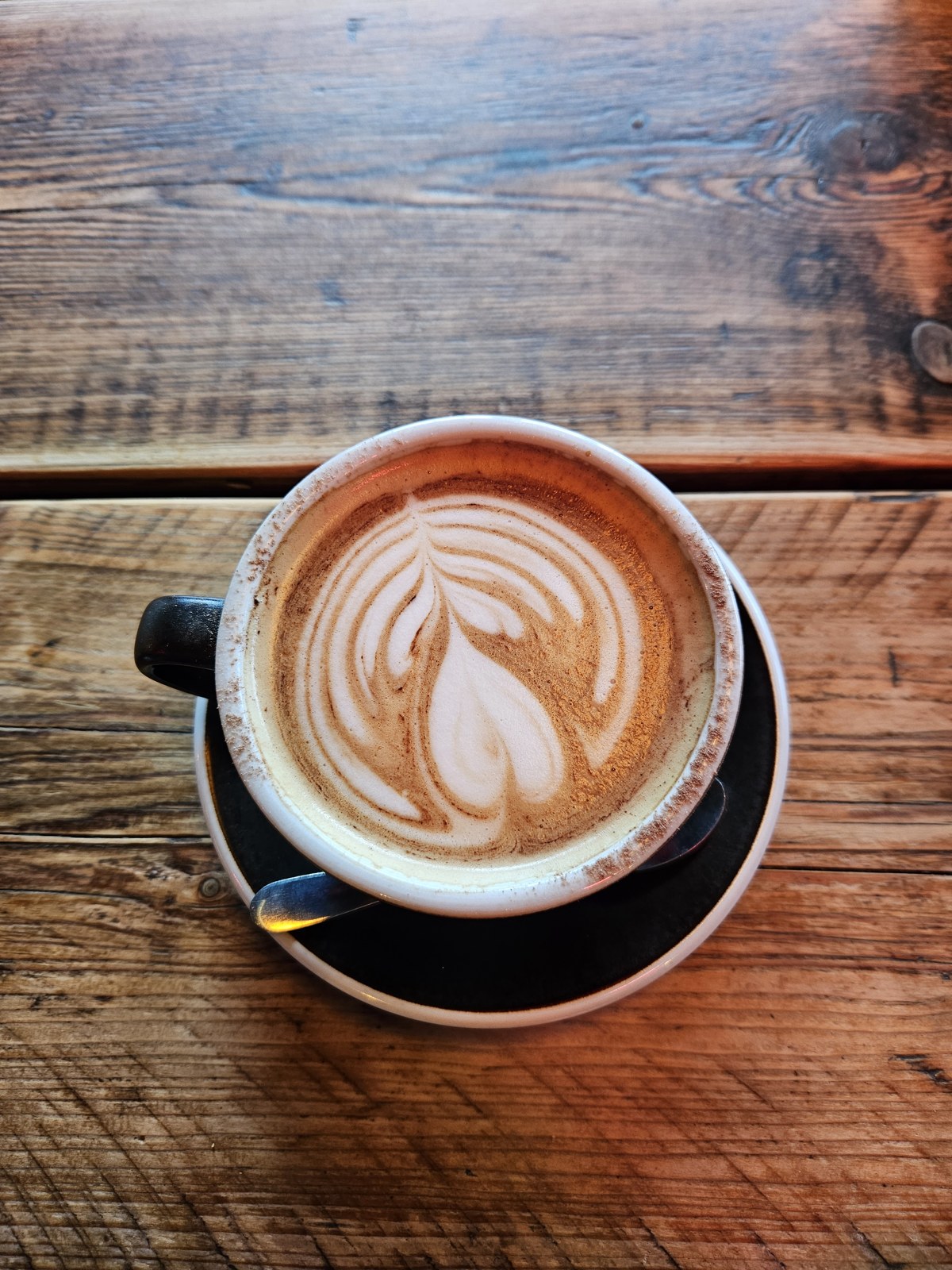A latte on a wooden table