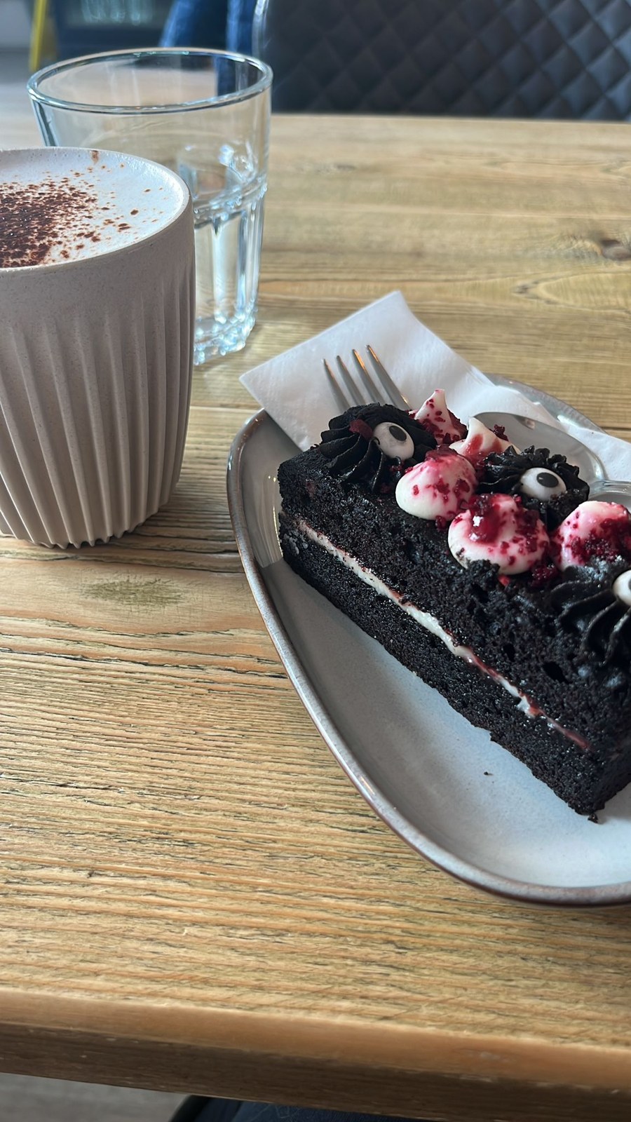 A coffee and cake on a wooden table