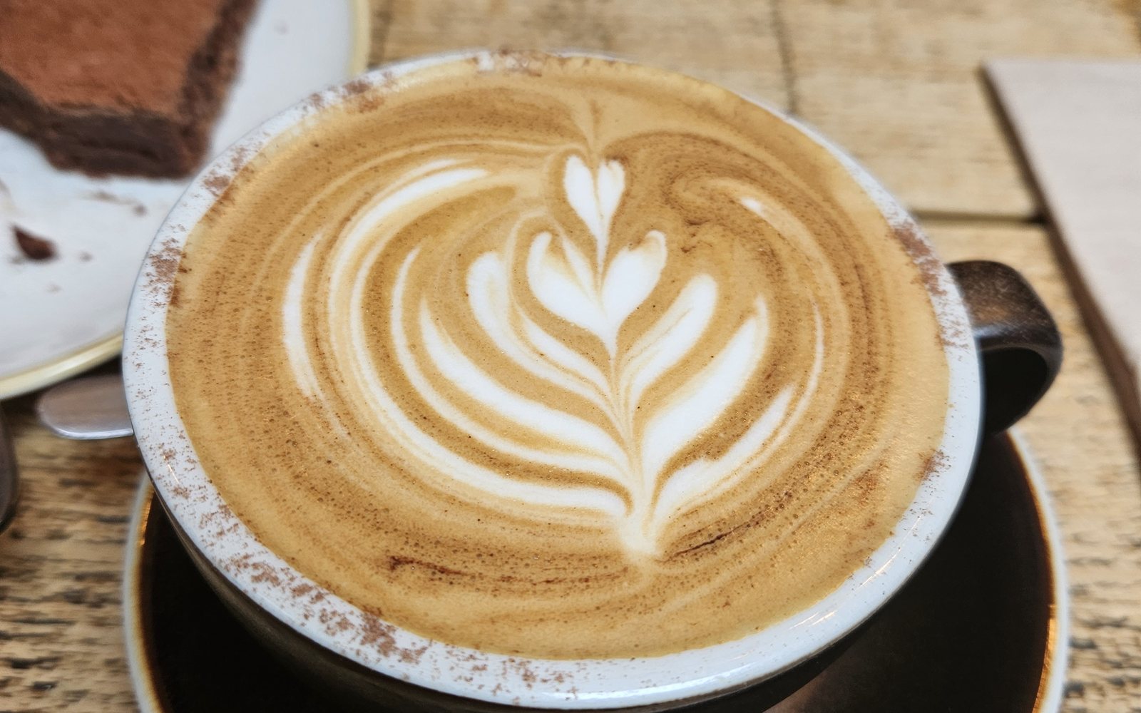 Latte and brownie on a table